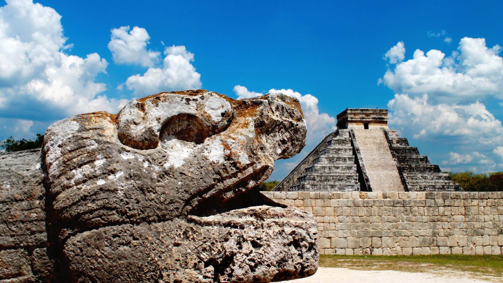 Serpent and temple at Mayan ruins.