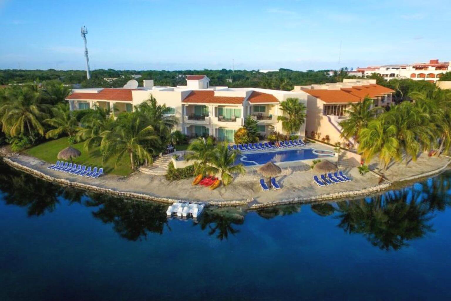 An airial view of Aventuras Club Lagoon, showing the rear of the property pool and beach.