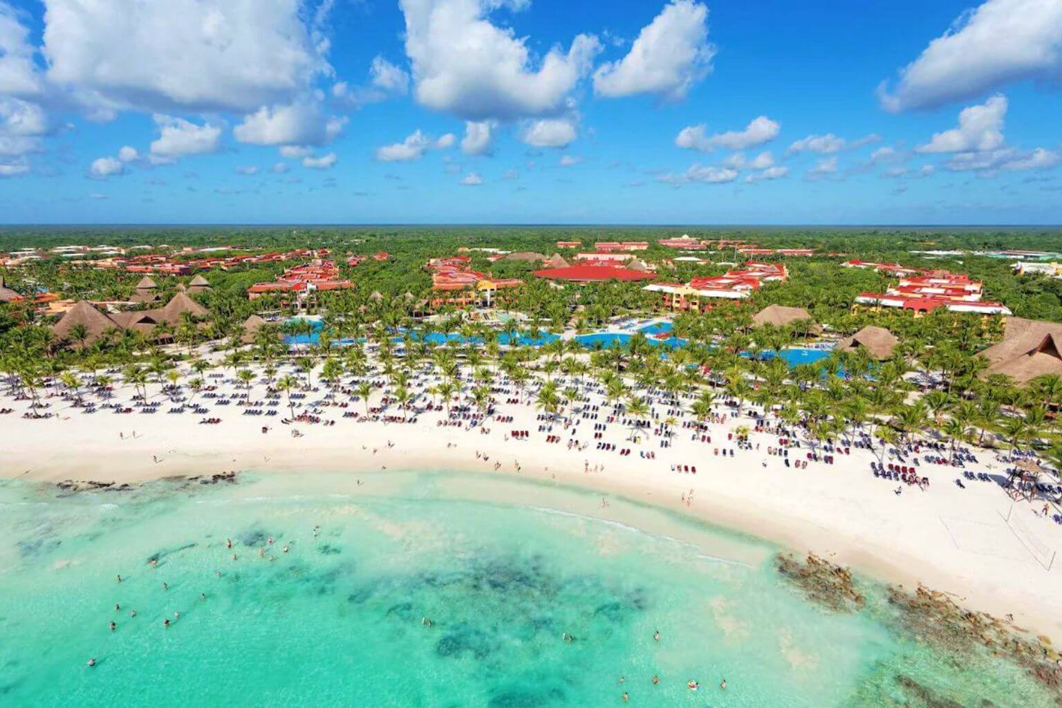 Aerial view from the ocean looking at the beach area of the Barcelo Maya Tropical Hotel.