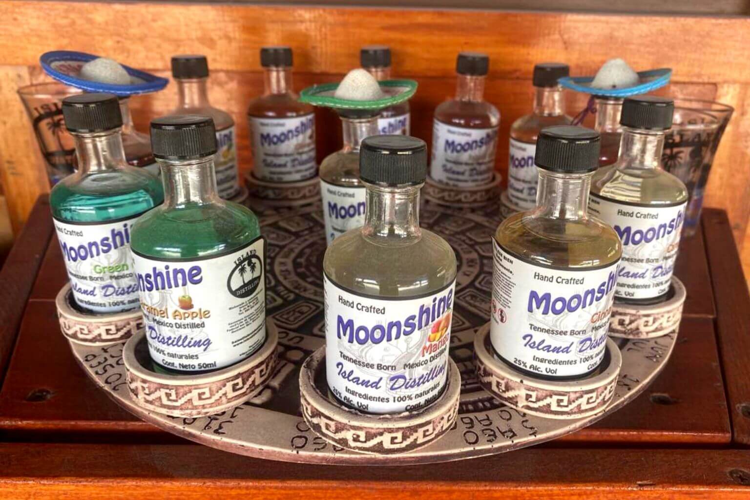 A platter of 13 different flavors of Mexican Moonshine, displayed in the Island Distilling shop.