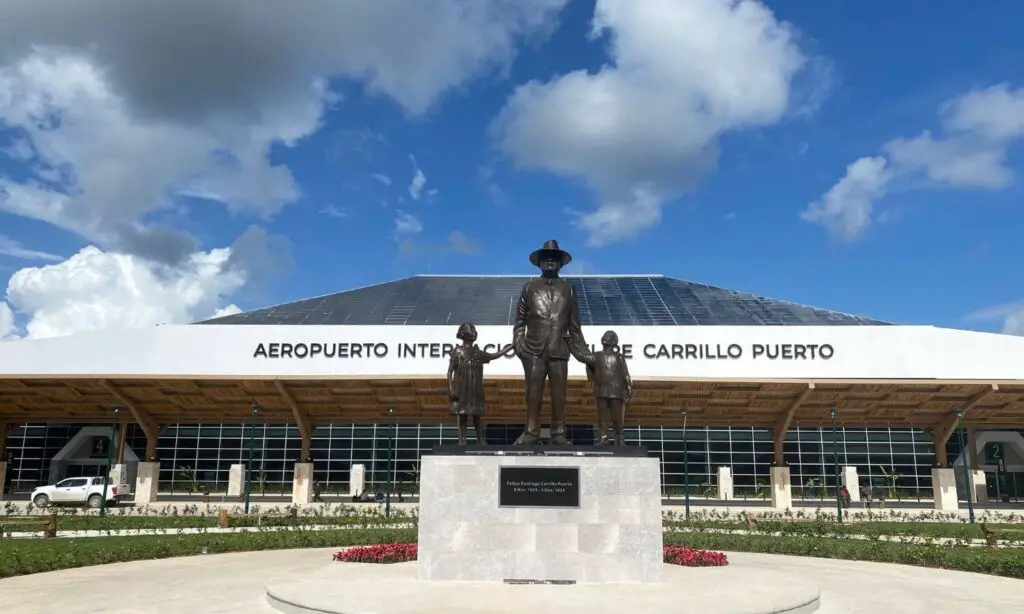 statue of felipe carillo puerto at the tulum international airport