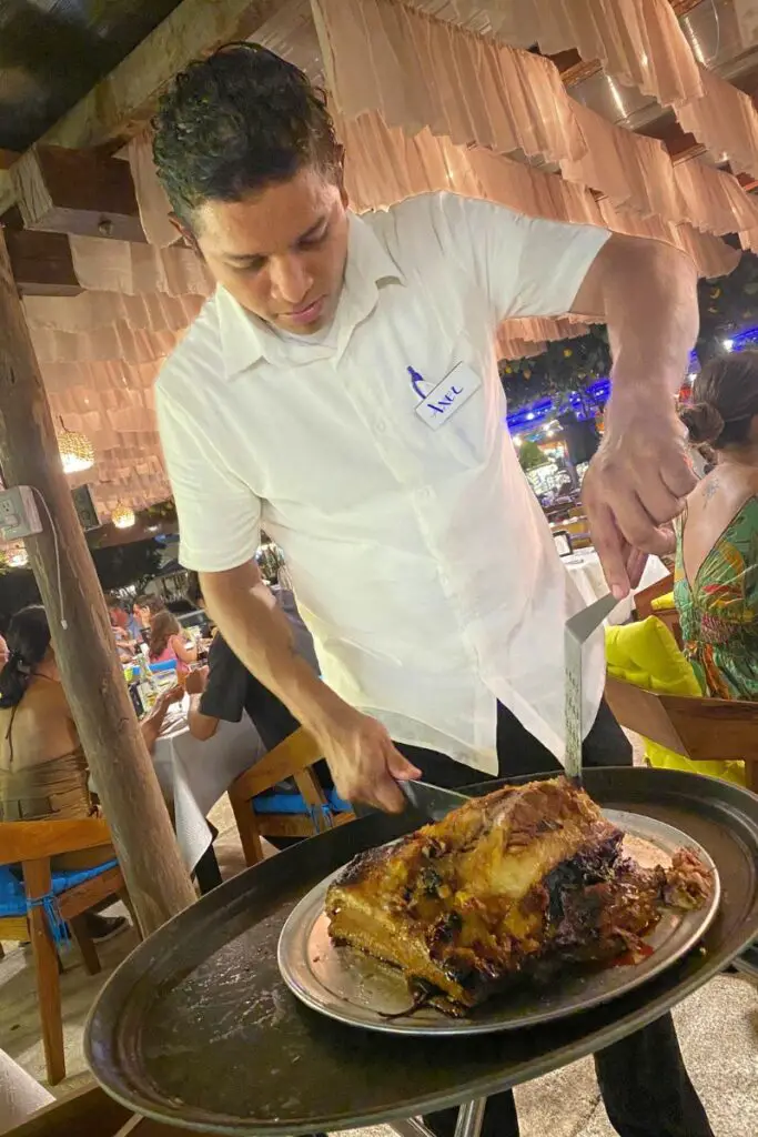 Brasa Nova: A New Brazilian Steakhouse in Puerto Aventuras 3 server cutting meat at brasa nova brazilian steakhouse in puerto aventuras