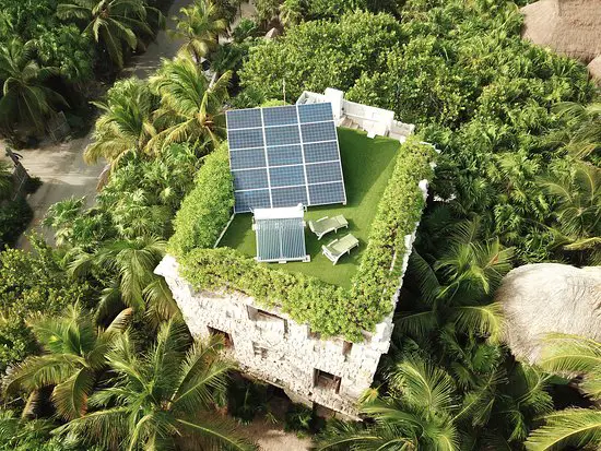 How to Lower Your CFE Bill: Energy-Saving & Solar Tips for the Riviera Maya 4 solar panels on green roof in tulum